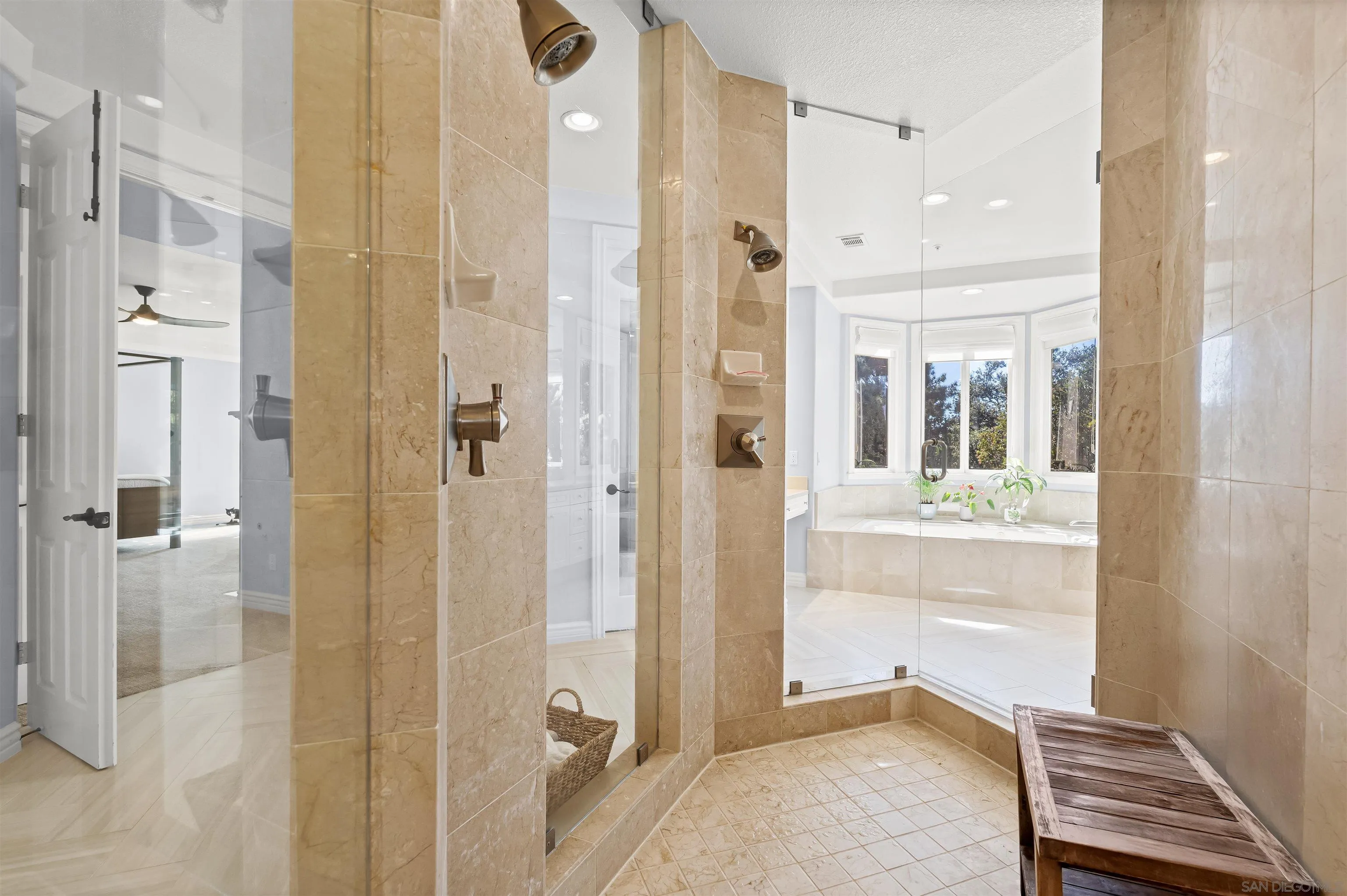 301 Cantle Lane Encinitas, CA 92024 - Photo 38 of 75 a bathroom with a glass shower door and a sink