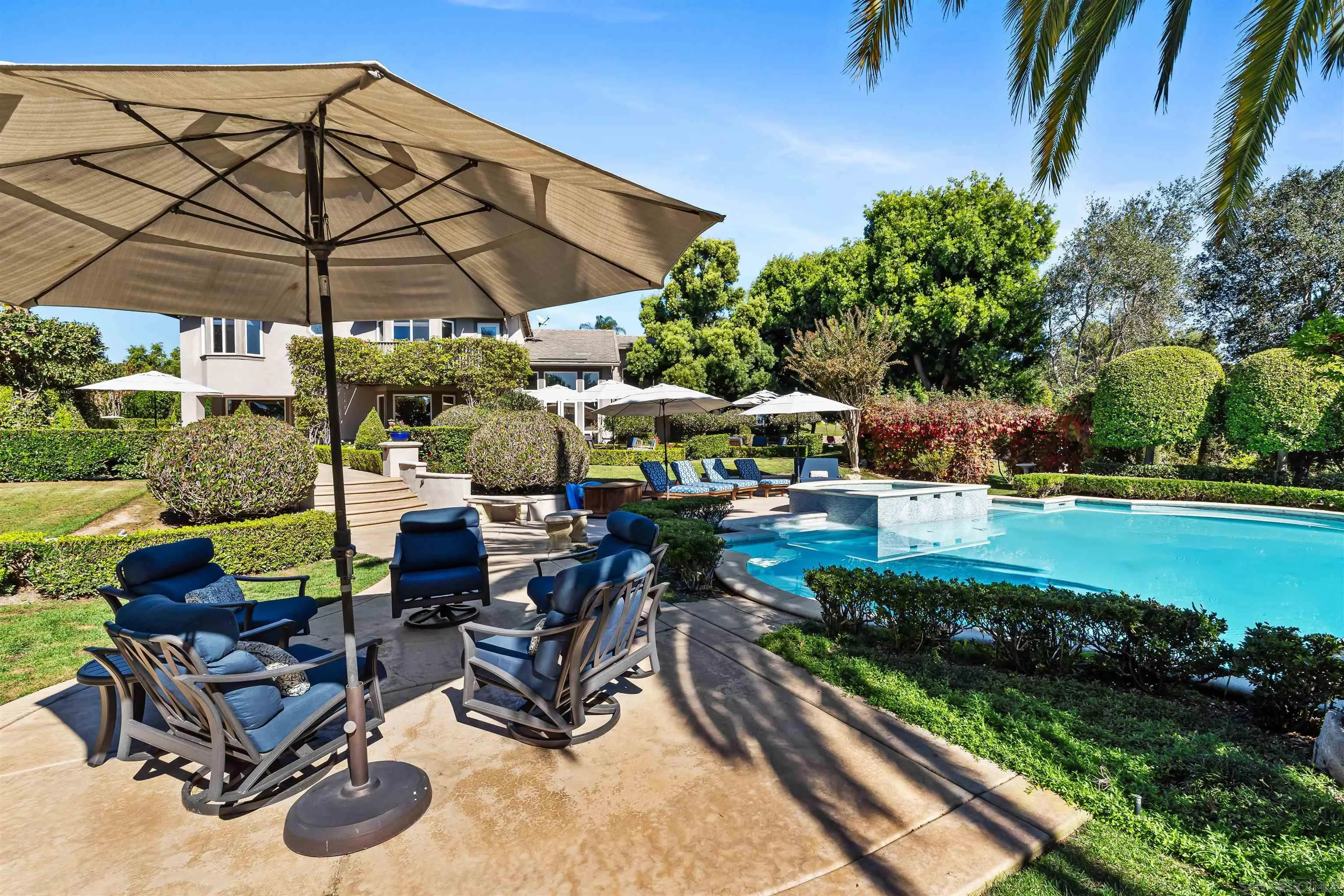 301 Cantle Lane Encinitas, CA 92024 - Photo 44 of 75 a view of a patio with chairs and a yard