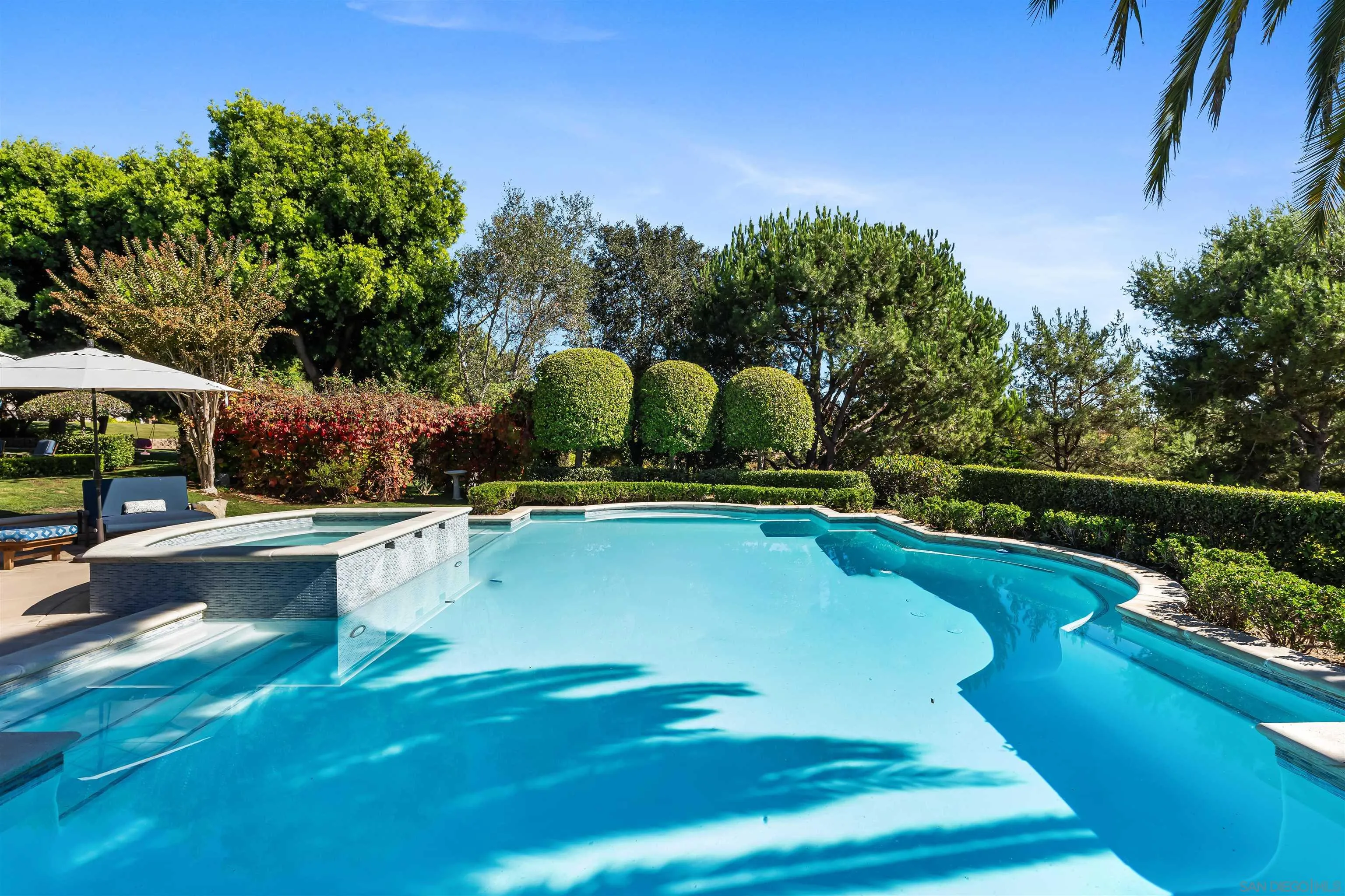 301 Cantle Lane Encinitas, CA 92024 - Photo 45 of 75 a view of a swimming pool with a patio