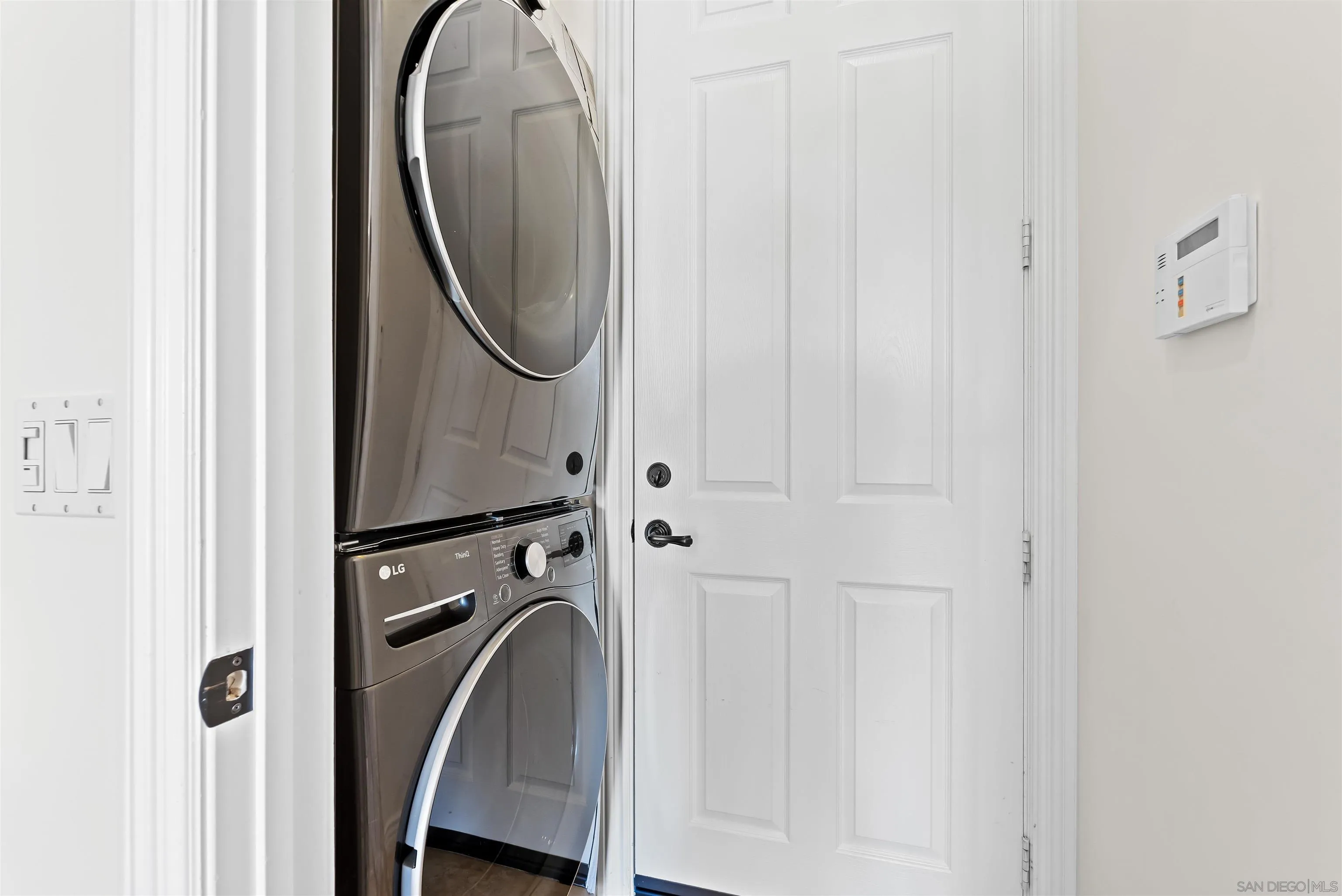 301 Cantle Lane Encinitas, CA 92024 - Photo 65 of 75 a utility room with dryer and washer