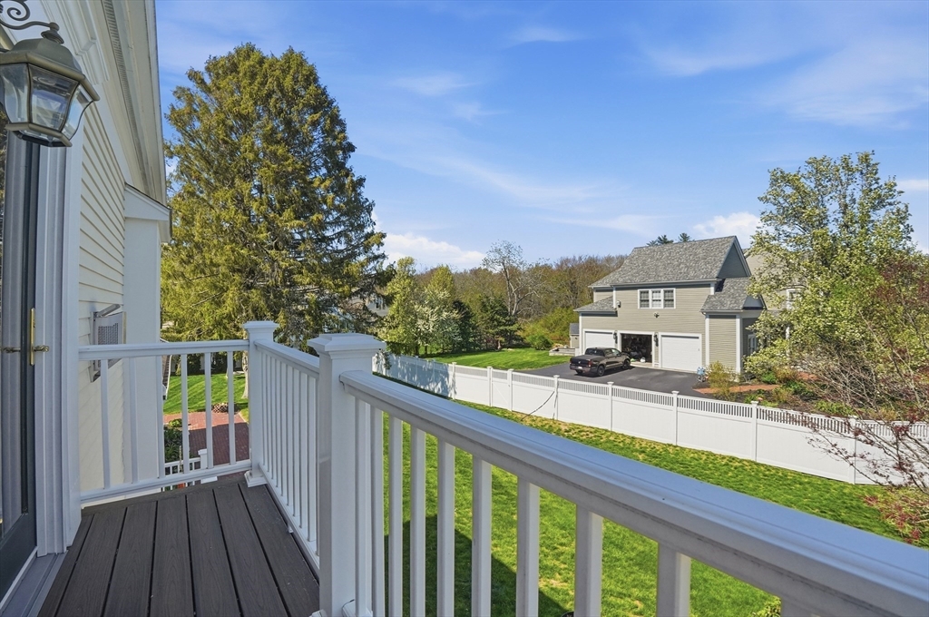 183 Whiting Street Hanover, MA 02339 - Photo 35 of 42 a view of a balcony with wooden floor and fence