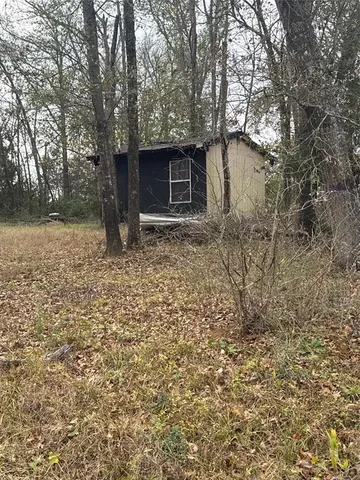 a house with trees in front of it