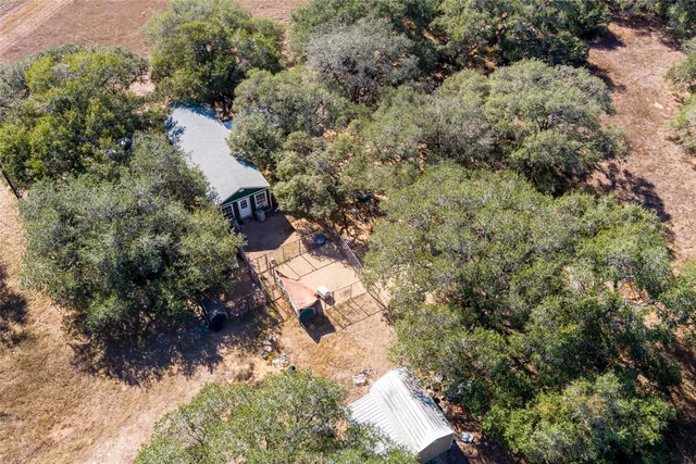 an aerial view of residential house with outdoor space