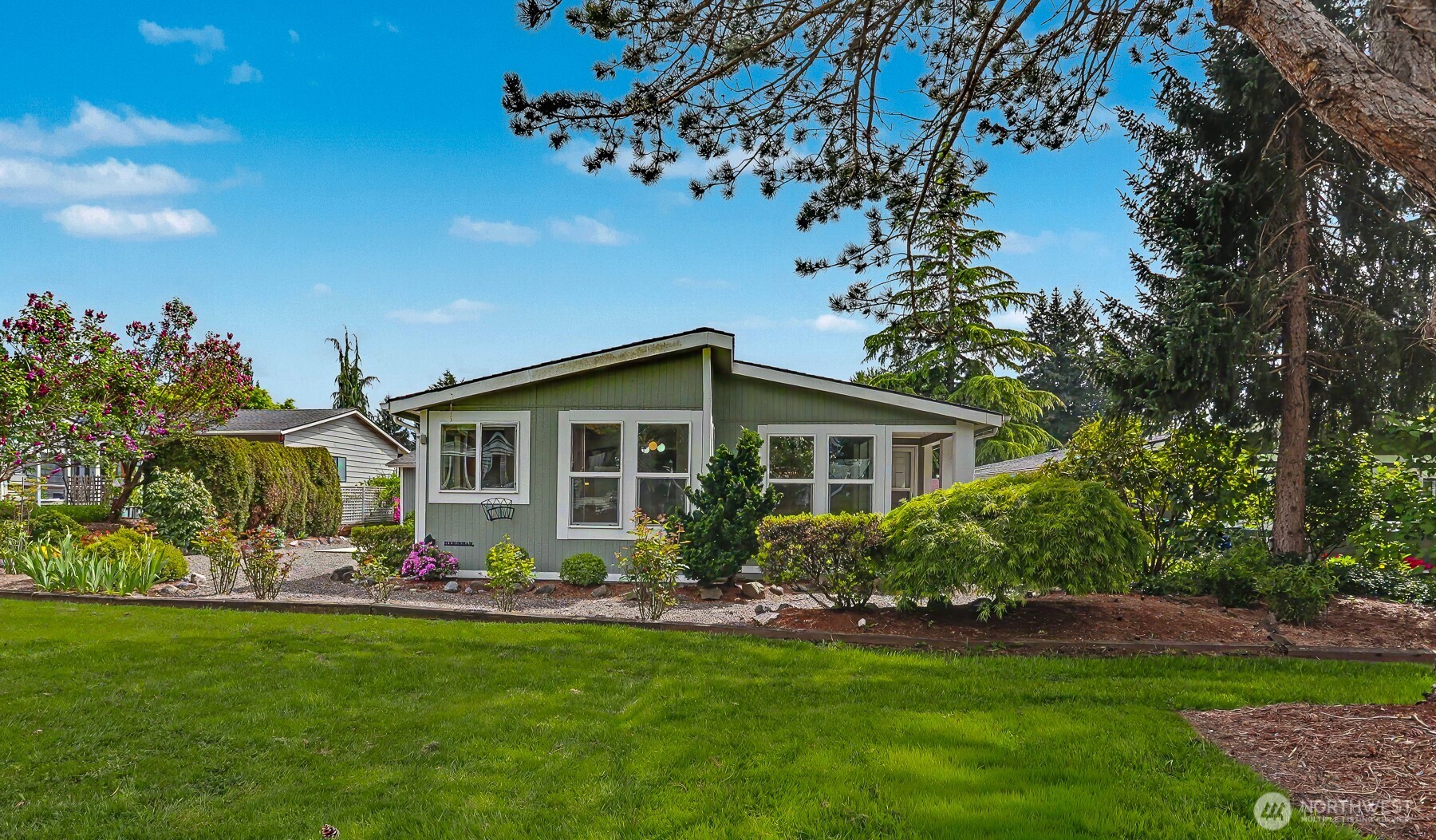 a front view of house with yard and green space
