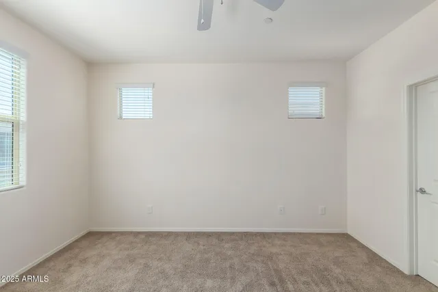 a bathroom with a double vanity sink mirror and shower