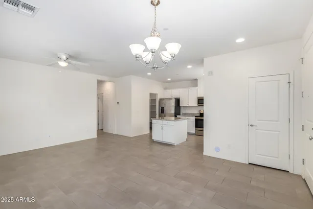 a view of a kitchen with a sink and microwave