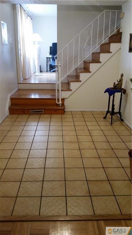34 Lynnwood Road Edison, NJ 08820 - Photo 3 of 11 a view of staircase with white walls