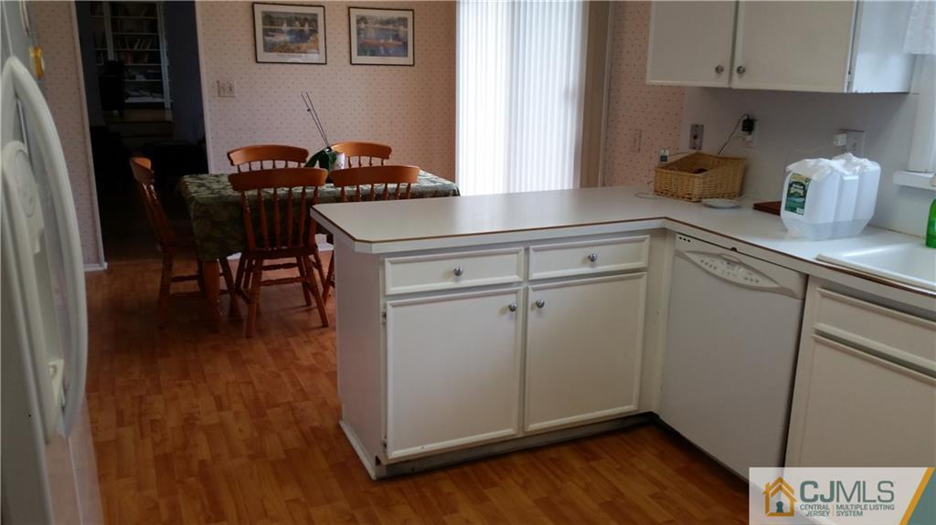 34 Lynnwood Road Edison, NJ 08820 - Photo 7 of 11 a kitchen with cabinets and wooden floor