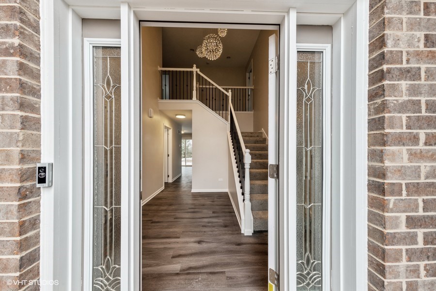 24358 Liberty Street Crete, IL 60417 - Photo 2 of 16 a front door of a house with wooden floor