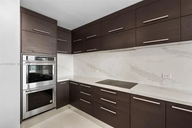 a lobby with furniture and floor to ceiling window