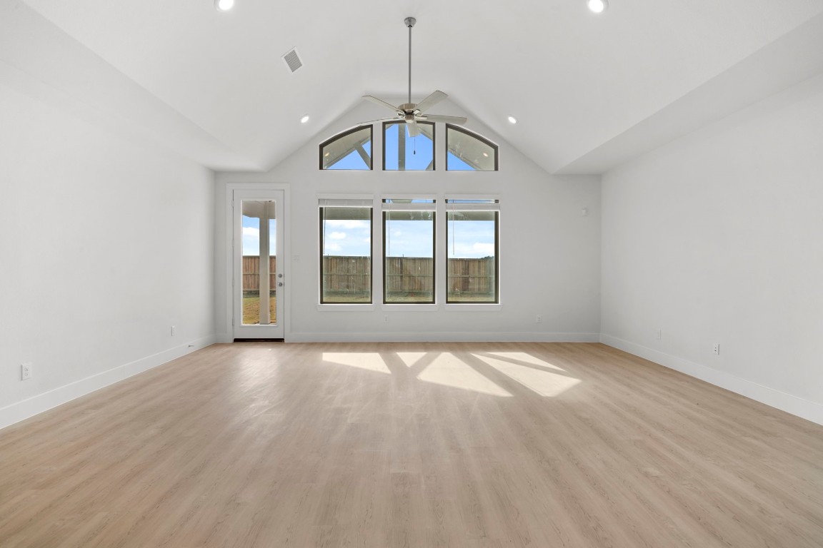 644 Cross Timbers Trace Waller, TX 77484 - Photo 12 of 33 a view of an empty room with wooden floor and a window