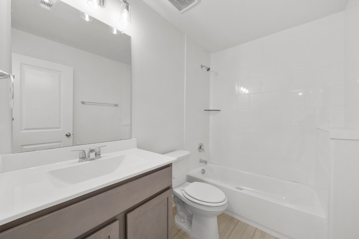 644 Cross Timbers Trace Waller, TX 77484 - Photo 24 of 33 a bathroom with a sink a toilet and shower