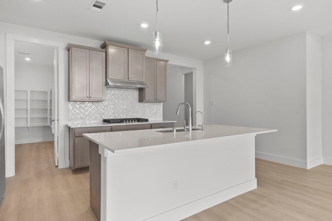 644 Cross Timbers Trace Waller, TX 77484 - Photo 5 of 33 a large white kitchen with a sink and dishwasher