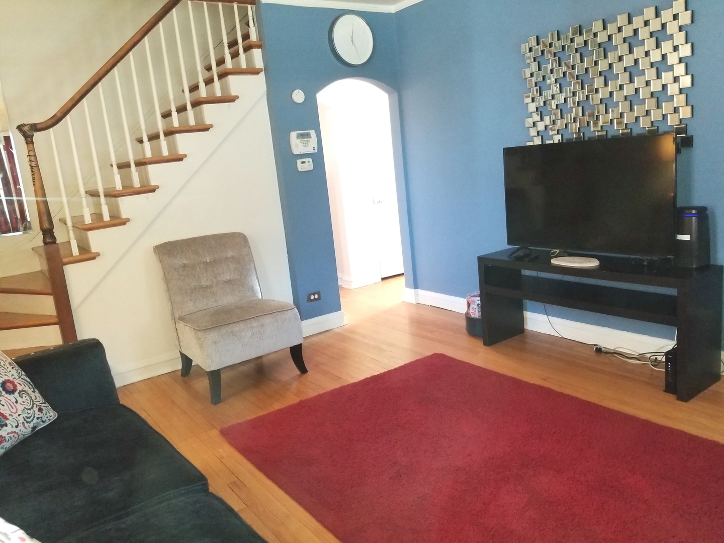 10637 South Normal Avenue Chicago, IL 60628 - Photo 2 of 8 a living room with furniture and a flat screen tv