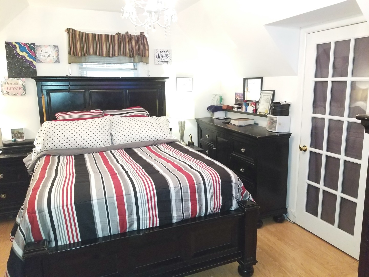 10637 South Normal Avenue Chicago, IL 60628 - Photo 7 of 8 a bedroom with a bed and wooden floor