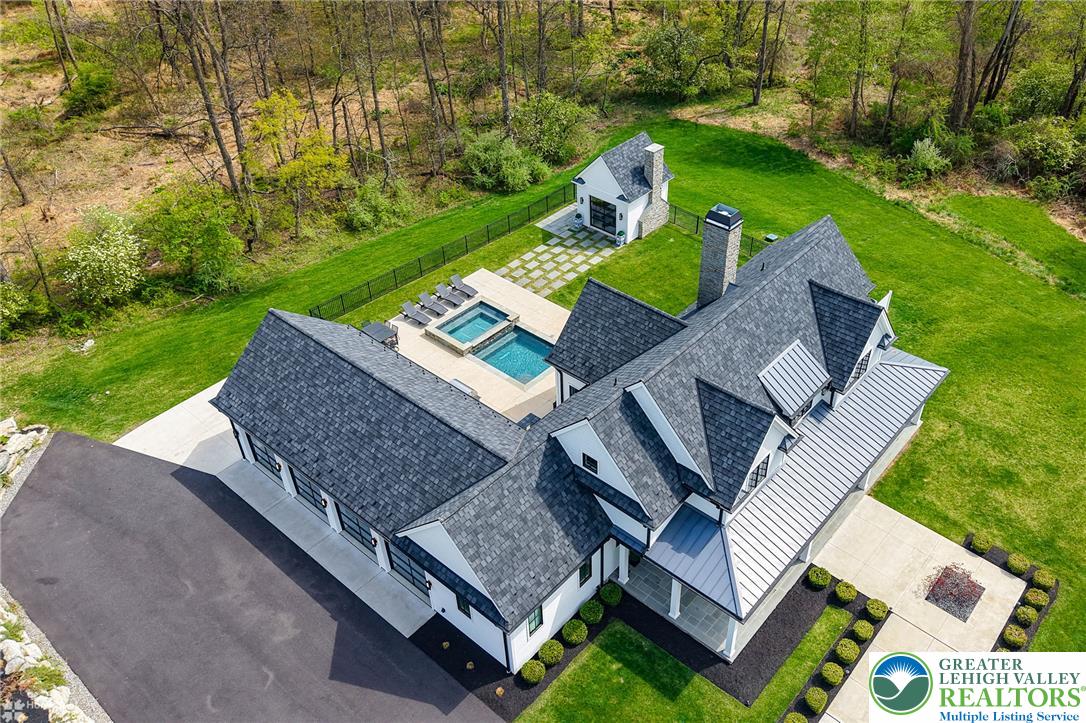 4850 West Hopewell Road Center Valley, PA 18034 - Photo 28 of 96 an aerial view of a house with garden space and street view