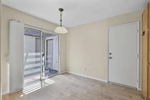 a view of a room with window and a chandelier