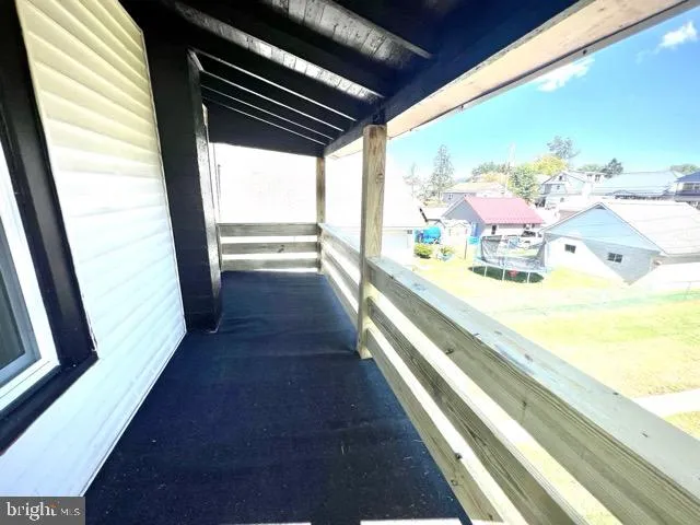 a view of kitchen with furniture and natural light