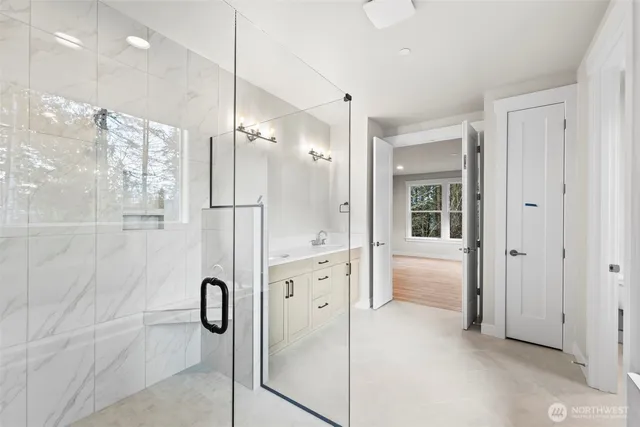 a bathroom with a shower and a sink