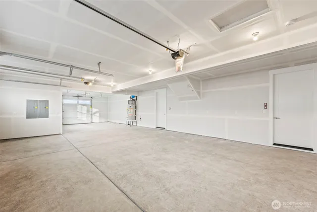 a view of empty room with a windows and cabinet