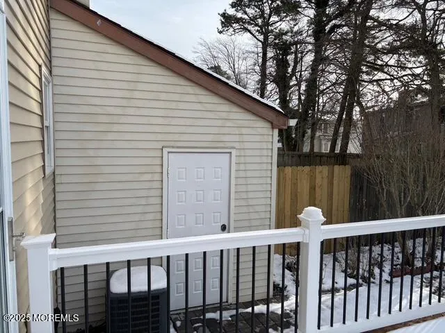 a view of a brick house with a small yard