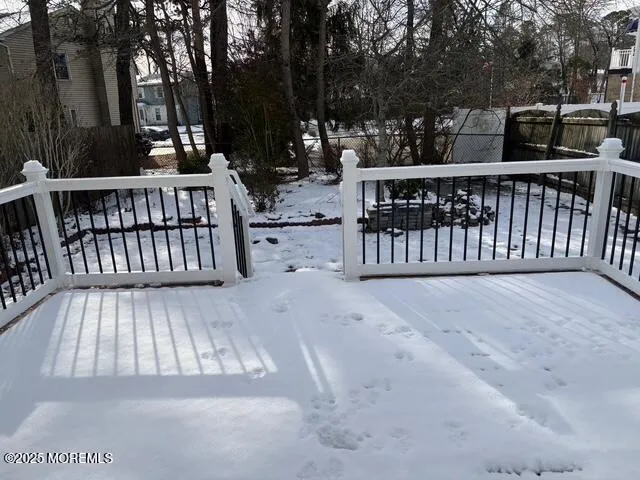 a view of backyard with deck and outdoor seating