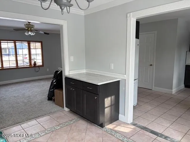 a kitchen with a refrigerator and a sink