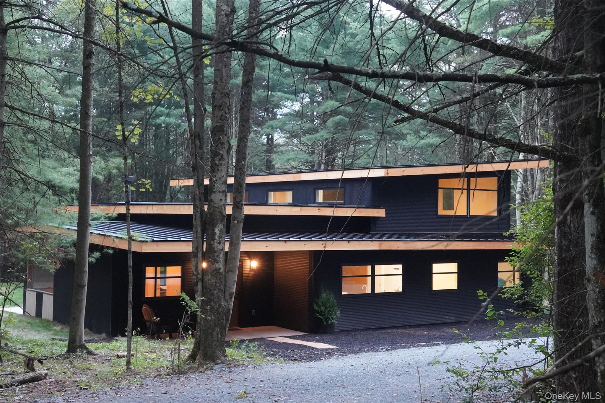 233 Goldsmith Road Jeffersonville, NY 12748 - Photo 1 of 30 a front view of a house with garden