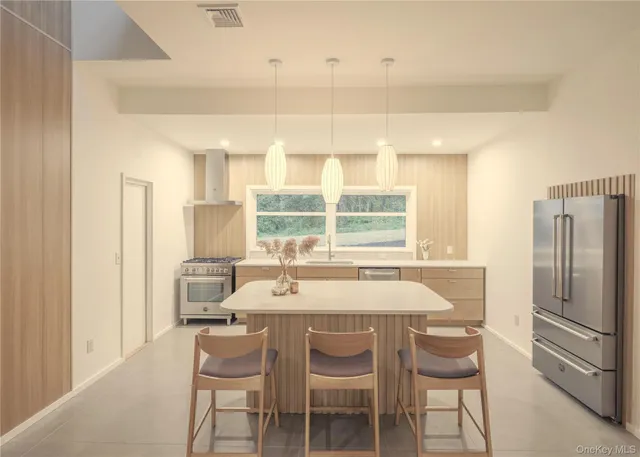 a dining room with furniture and a window