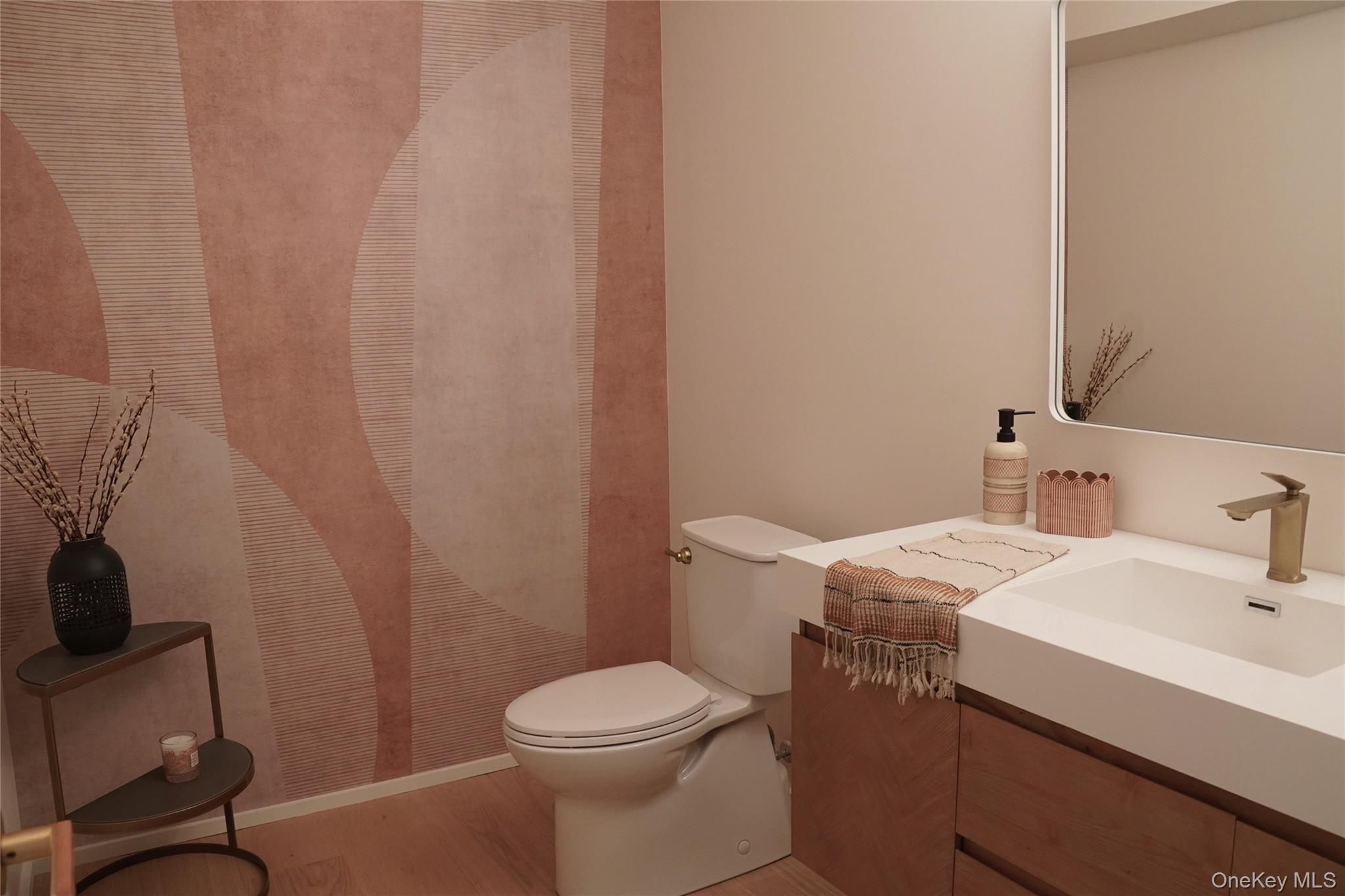 233 Goldsmith Road Jeffersonville, NY 12748 - Photo 16 of 30 a bathroom with a sink a toilet and a mirror