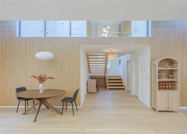 a view of a hallway with seating area
