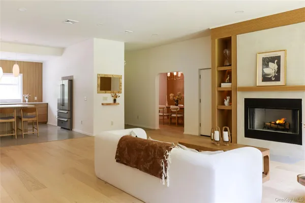 a spacious bedroom with a bed and a fireplace
