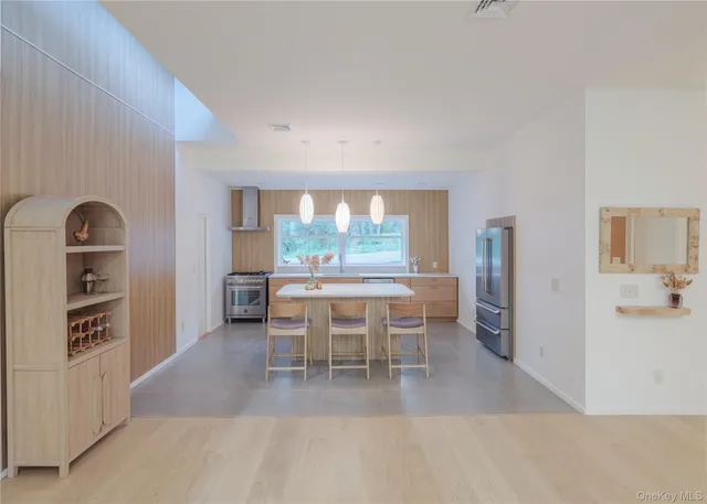 a dining room with furniture and window