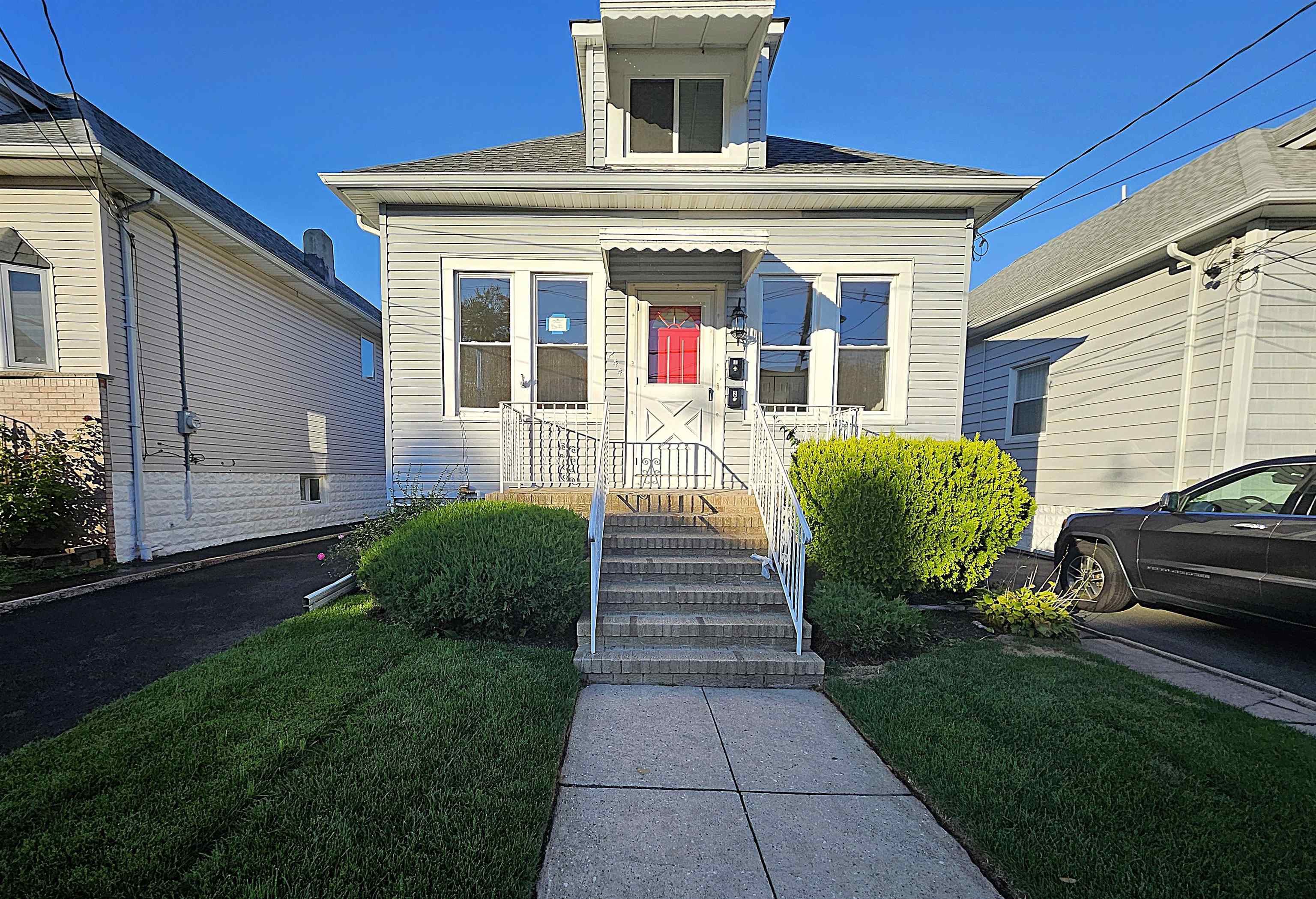244 Centre Avenue, Unit 1 Secaucus, NJ 07094 - Photo 9 of 23 a front view of a house with garden