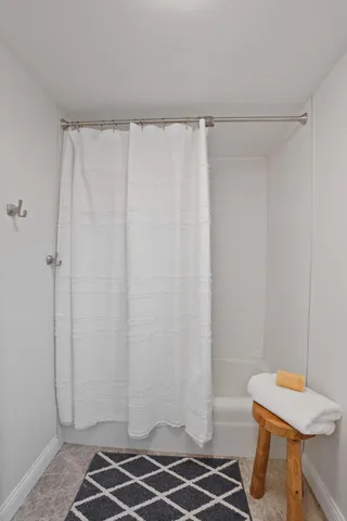 a bathroom with a sink and a shower