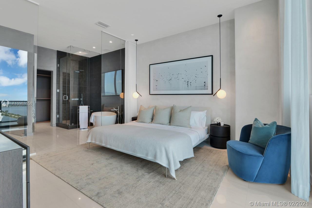 480 Northeast 31st Street, Unit PH5402 Miami, FL 33137 - Photo 12 of 35 a spacious bedroom with a bed couch and window