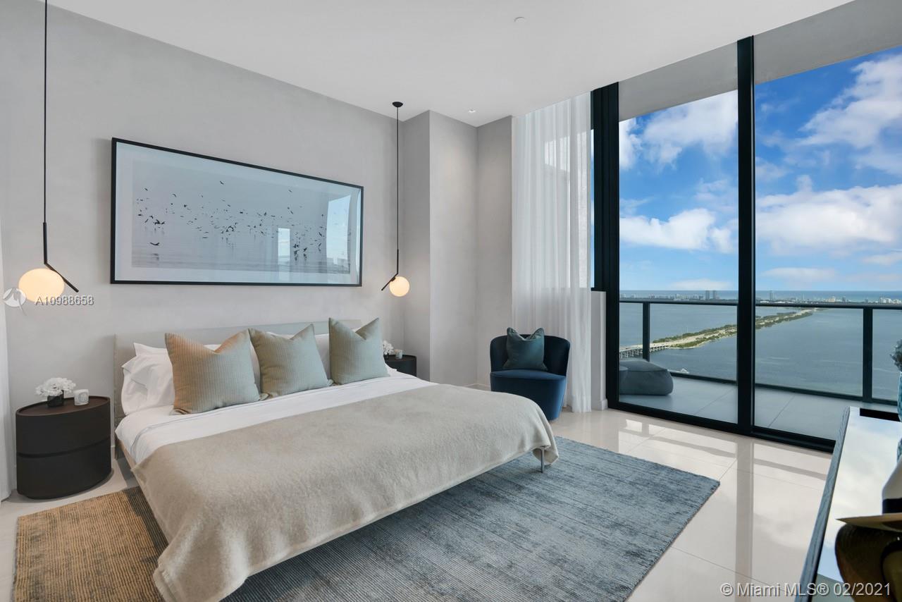 480 Northeast 31st Street, Unit PH5402 Miami, FL 33137 - Photo 14 of 35 a bedroom with a bed and wooden floor