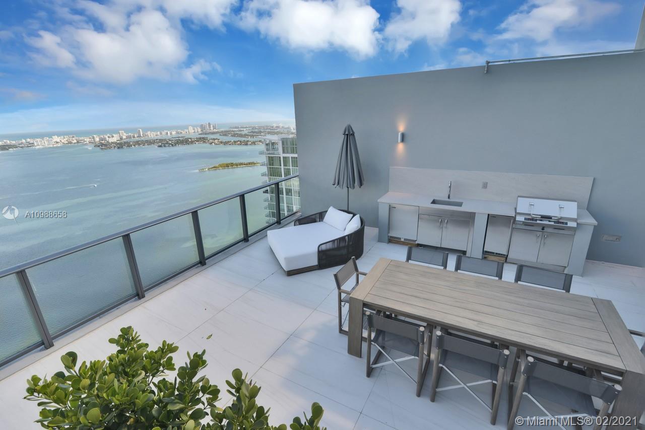 480 Northeast 31st Street, Unit PH5402 Miami, FL 33137 - Photo 30 of 35 a view of a terrace with furniture and a potted plant