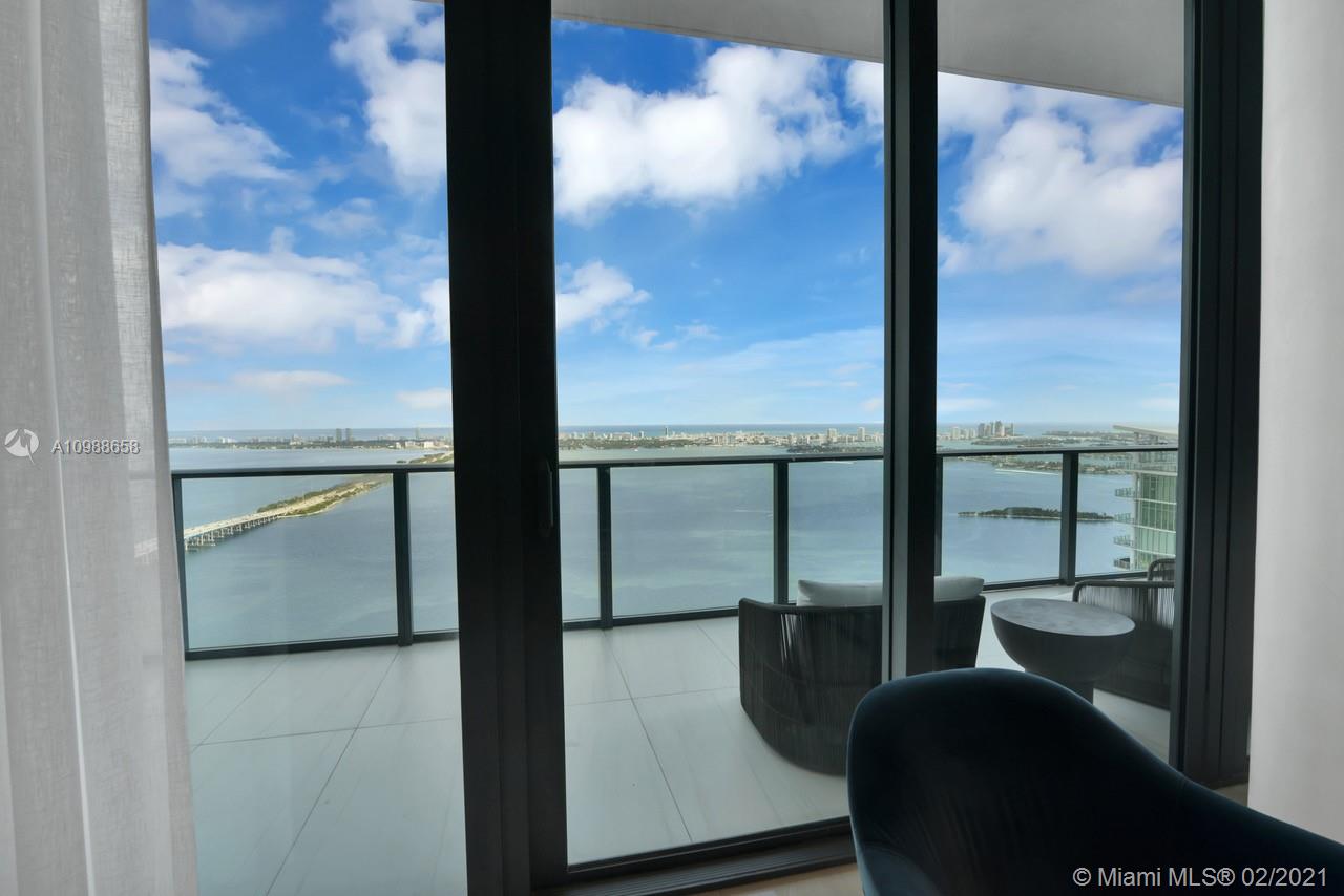 480 Northeast 31st Street, Unit PH5402 Miami, FL 33137 - Photo 8 of 35 a view of a glass door and chair