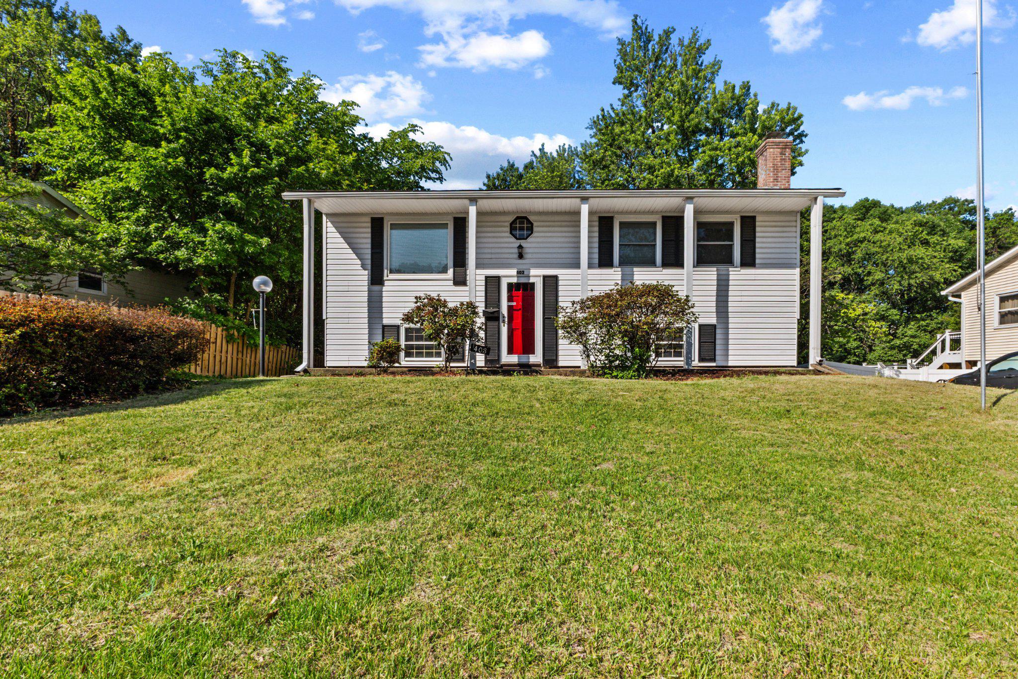 front view of a house with a big yard