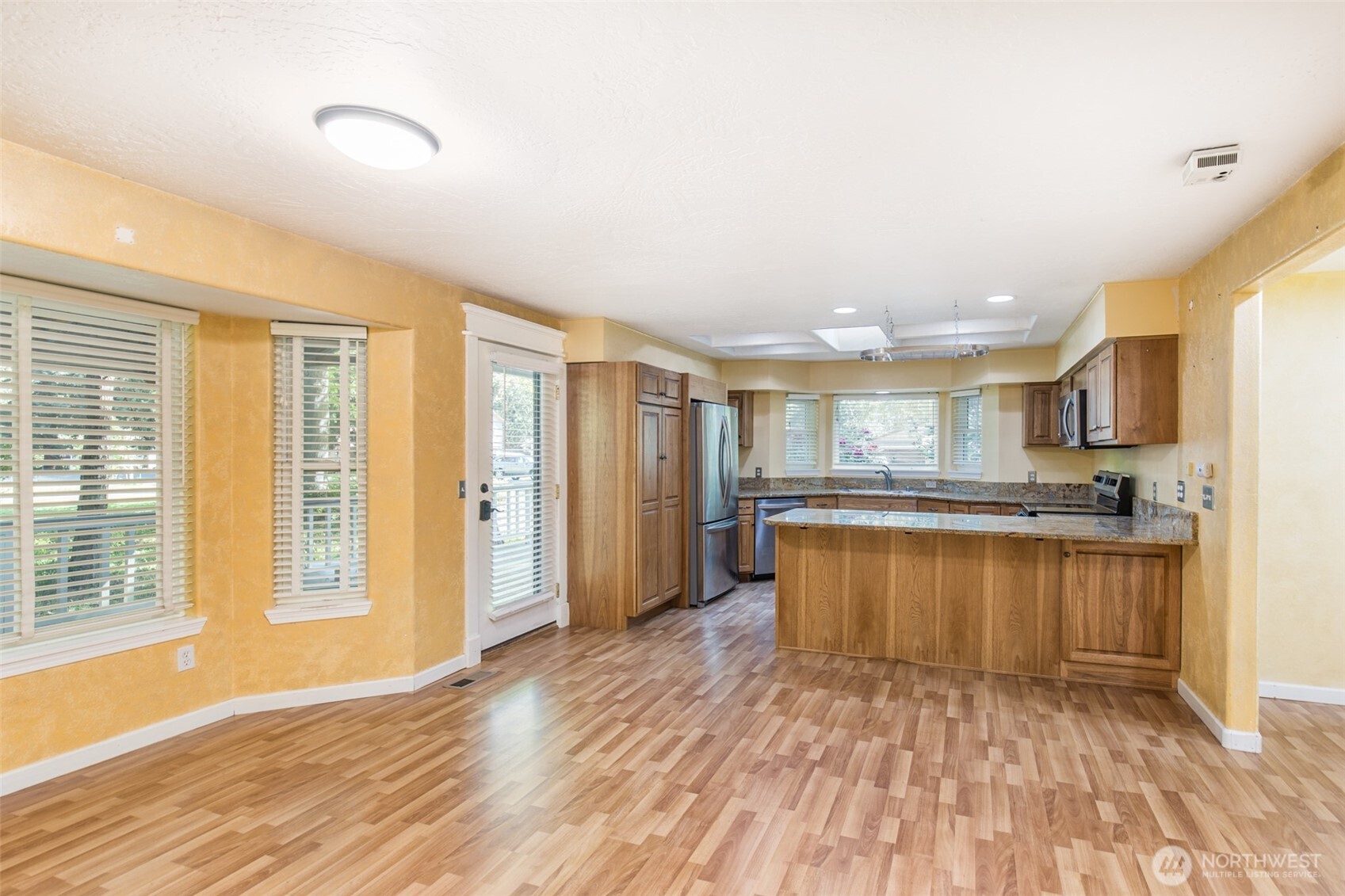 123 Forest Ridge Drive Sequim, WA 98382 - Photo 16 of 32 a large kitchen with stainless steel appliances granite countertop a refrigerator and a stove top oven