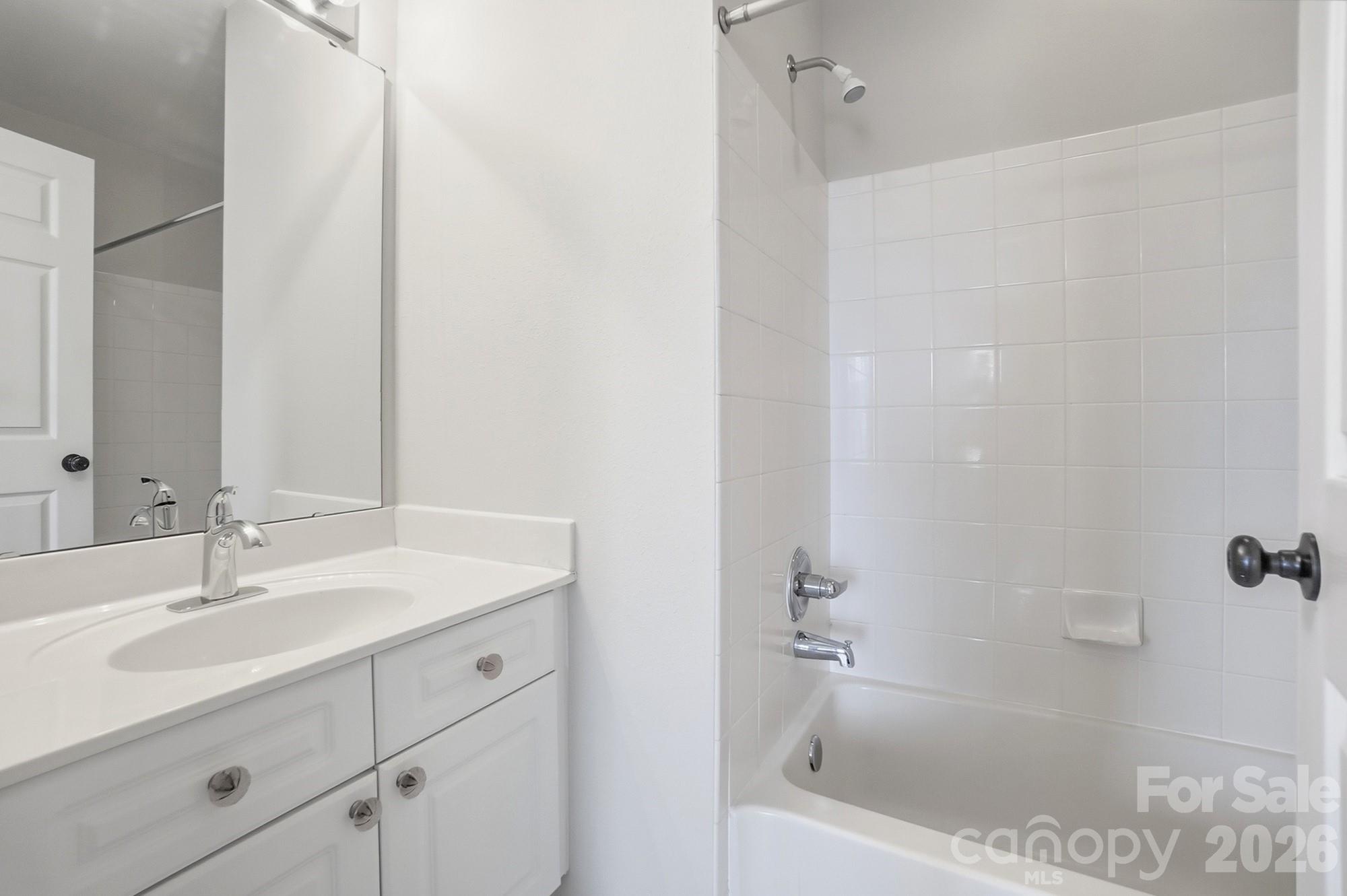 711 Stone Village Drive Fort Mill, SC 29708 - Photo 38 of 46 a bathroom with a sink and a bathtub
