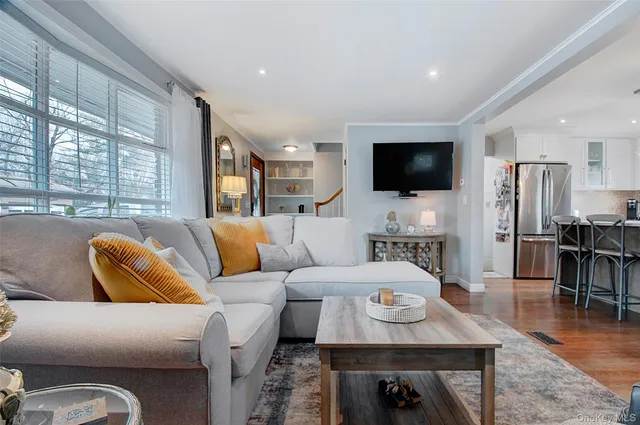 a view of a dining room with furniture wooden floor and chandelier