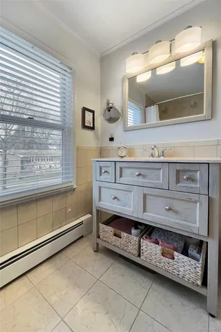 a view of a hallway with wooden floor and entryway