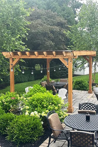 a view of a livingroom with furniture and a window