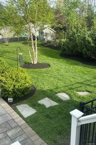 a view of a chairs and table in patio