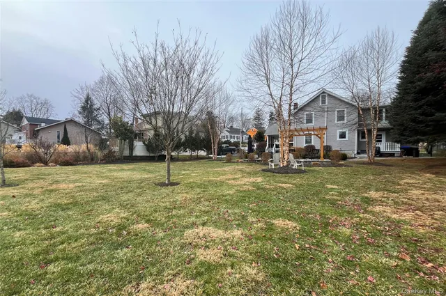 a view of a patio with table and chairs and potted plants