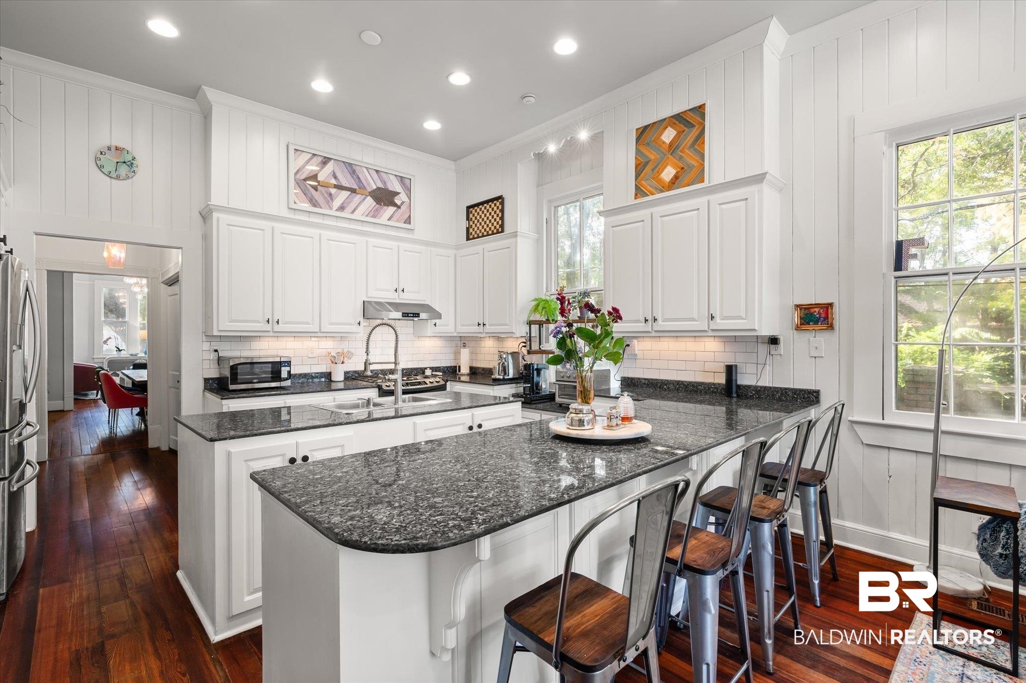 1210 Government Street Mobile, AL 36604 - Photo 10 of 37 Kitchen with white cabinetry, stainless steel appliances, dark wood-type flooring, and sink