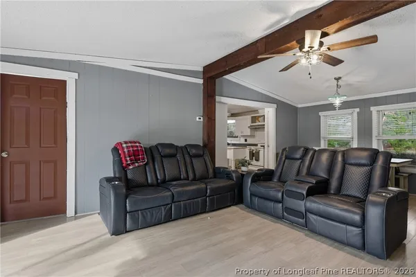 a kitchen with stainless steel appliances granite countertop a stove a refrigerator and a microwave