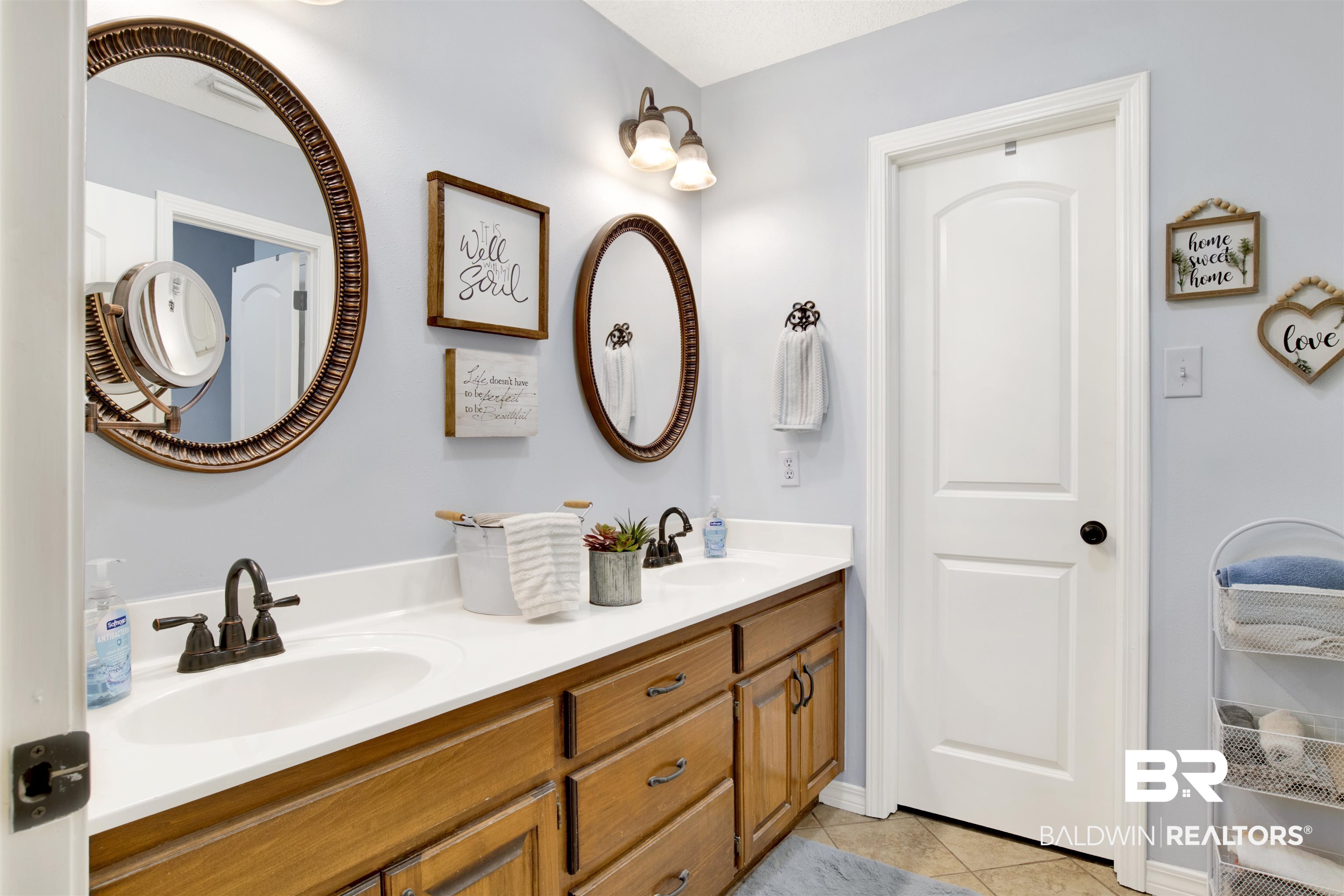 13385 Tom Gaston Road Mobile, AL 36695 - Photo 21 of 42 Bathroom featuring tile patterned flooring and vanity
